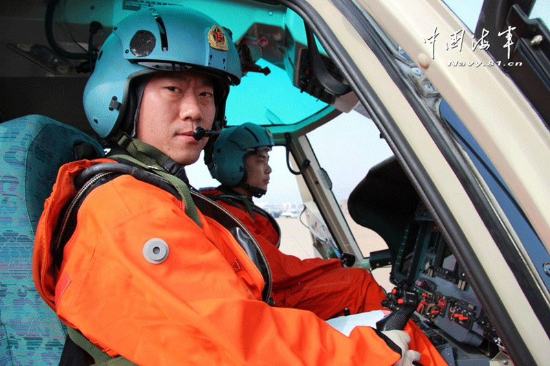 A ship-borne helicopter is in anti-submarine drills in the Yellow Sea under complicated weather conditions. (China Military Online)