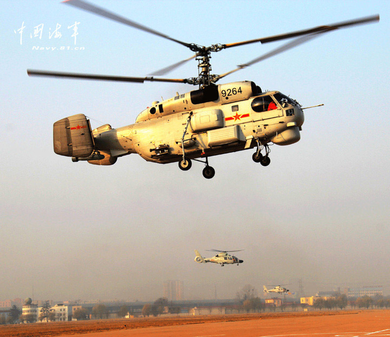 Ship-borne helicopters are in anti-submarine drills in the Yellow Sea under complicated weather conditions. (China Military Online)