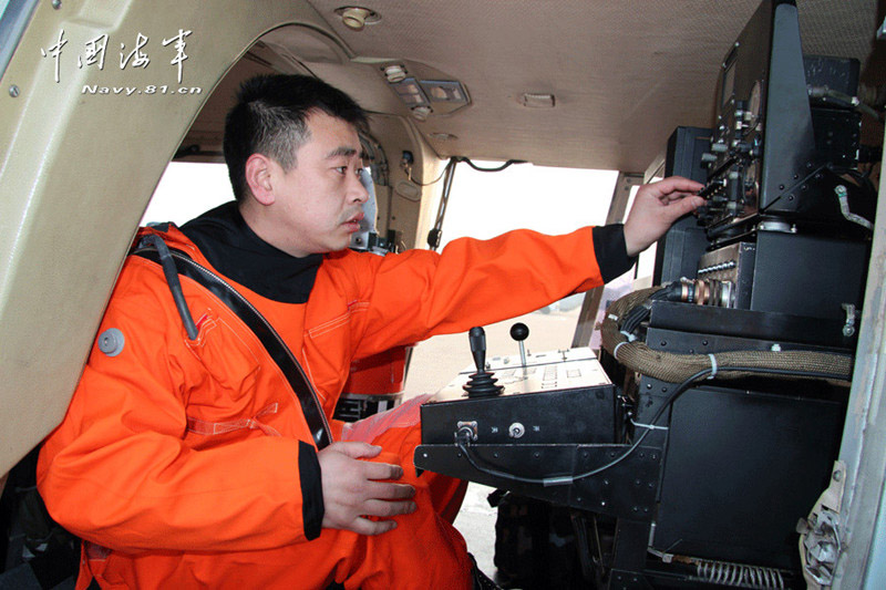 Multiple types of ship-borne helicopters of the aviation force under the North China Sea Fleet of the Navy of the Chinese People's Liberation Army (PLA) carried out the collaborative anti-submarine drills in the Yellow Sea under complicated weather conditions.  (China Military Online)