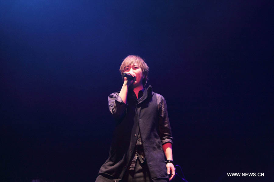 Ashin, lead singer of pop band Mayday from southeast China's Taiwan, performs during a charity concert in Guangzhou, capital of Guangdong Province, late May 2, 2013. (Xinhua Photo)