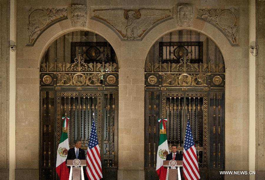 Mexican President Enrique Pena Nieto (R) and U.S. President Barack Obama attend a joint press conference after a bilateral meeting at the National Palace in Mexico City, capital of Mexico, on May 2, 2013. Obama visits Mexico to meet with Pena Nieto and analyze matters concerning education, infrastructure, commerce, migration and security, according to the local press. (Xinhua/David de la Paz) 