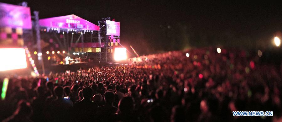 A flag calling for "rock and youth" is seen during the 5th Strawberry Music Festival at the Tongzhou Canal Park in Beijing, capital of China, April 30, 2013. The three-day festival, which attracted more than 160 performing teams from home and abroad, concluded on May 1. (Xinhua/Yao Jianfeng)