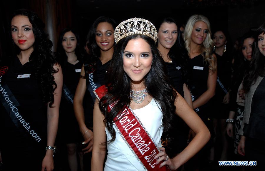 Tara Teng (C), Miss World Canada 2012, and contestants from this year's pageant pose for photos during a media event in Vancouver, Canada, on May 2, 2013. Miss World Canada 2013 will be held on May 9 in Richmond, British Columbia, and the winner will represent Canada at Miss World 2013 event in Jakarta, capital of Indonesia, in September. (Xinhua/Sergei Bachlakov)