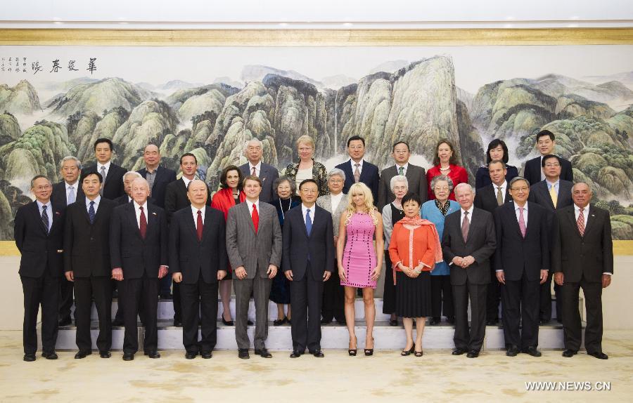 Chinese State Councilor Yang Jiechi (C front) poses for a group photo during his meeting with a delegation of Richard Nixon Foundation headed by Christopher Cox, a grandson of former U.S. President Richard Nixon, in Beijing, capital of China, May 3, 2013. (Xinhua/Xie Huanchi)