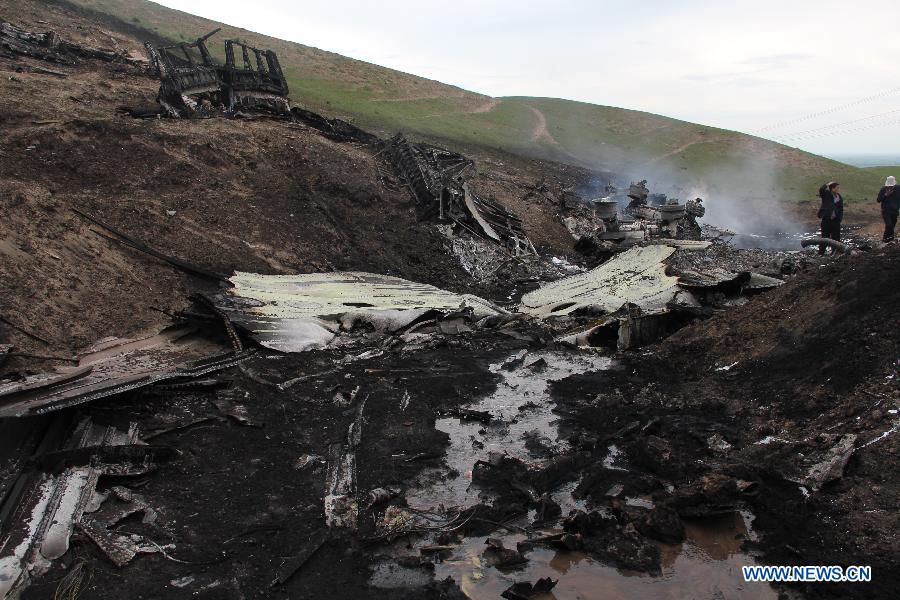 Photo taken on May 3, 2013, shows the scene after a U.S. military plane crashed in Kyrgyzstan. A U.S. military plane crashed Friday in Kyrgyzstan, the country's emergency situations ministry said. There was no immediate word on any casualties but the ministry said preliminary information indicated that there were five people aboard. (Xinhua)