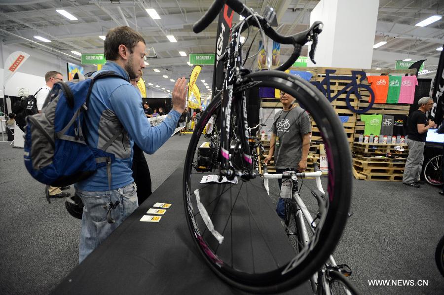 A bike fan visits the 2013 Bike Expo New York in New York City, the United States, May 3, 2013. (Xinhua/Wang Lei) 