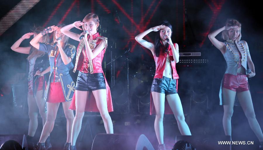 The band "Super Girls" performs during the May 4 Youth Day Music Festival in Hong Kong, south China, May 4, 2013. (Xinhua/Li Peng)