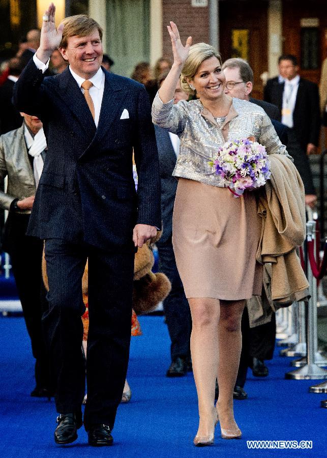 Dutch King Willem-Alexander and Queen Maxima arrive to attend the annual concert marking the Liberation Day on May 5, 2013 in Amsterdam. (Xinhua/Robin Utrecht)