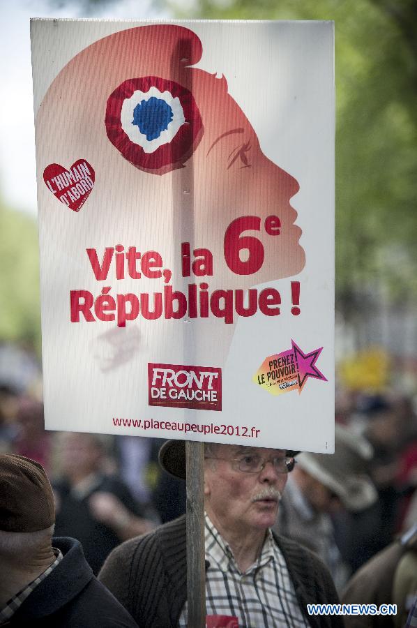 People participate in a demonstration in Paris, France, May 5, 2013. As the Socialists mark their first year in office, tens of thousands of protesters marched in towns across France on Sunday against president Francois Hollande's growth and job policy. (Xinhua/Etienne Laurent)