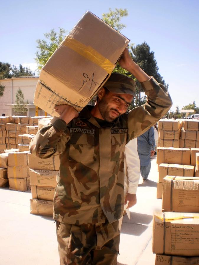 A Pakistani soldier carries a box of electoral materials for the forthcoming parliamentary elections in southwest Pakistan's Quetta, May 4, 2013. Pakistani Army has been deployed in nine out of 30 districts in sparsely populated Balochistan province. Violence has escalated as the country moves closer to historic elections, which are scheduled on 11 May. (Xinhua/Mohammad)