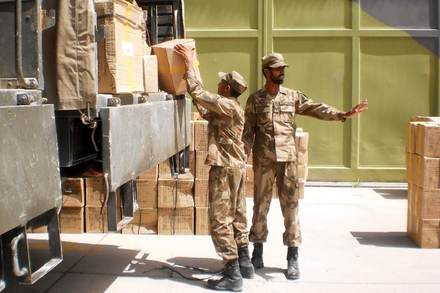 Pakistani soldiers unload boxes of electoral materials for the forthcoming parliamentary elections in southwest Pakistan's Quetta, May 4, 2013. Pakistani Army has been deployed in nine out of 30 districts in sparsely populated Balochistan province. Violence has escalated as the country moves closer to historic elections, which are scheduled on 11 May. (Xinhua/Mohammad)