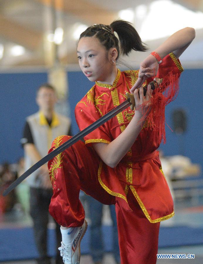 Maria Go of Canada competes during the 34th annual Can-Am International Martial Arts Championships in Richmond, BC, Canada, May 4, 2013. The annual Can-Am has several categories for competition, including Chinese traditional Kungfu, Wushu, Tai Chi, Karate and Taekwondo. (Xinhua/Sergei Bachlakov) 