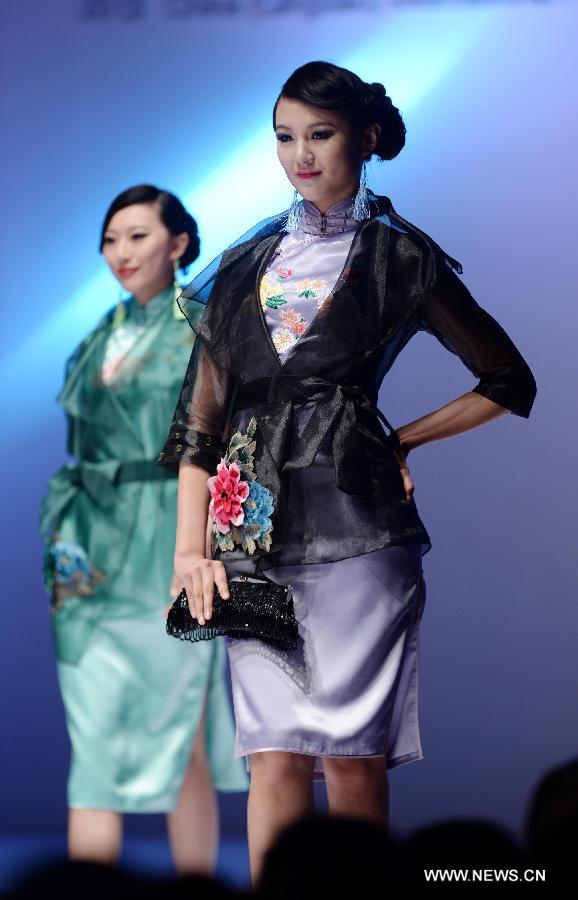 Models present fashion creations designed by Gao Lixin during the 2013 China (Qingdao) International Fashion Week in Qingdao, a coastal city in east China's Shandong Province, May 5, 2013. (Xinhua/Li Ziheng) 