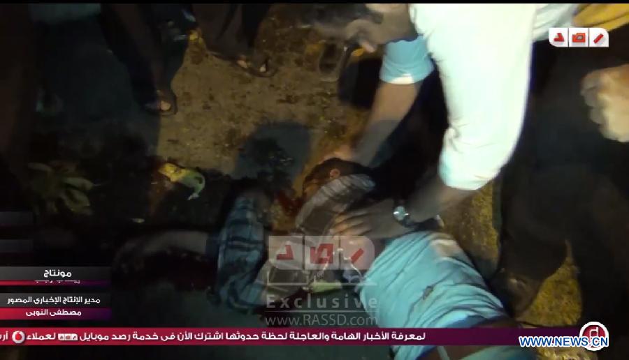 The screenshot photo taken from the website of Egyptian news channel Rassd on May 6, 2013 shows an injured Egyptian during the attack in Cairo, Egypt. Egyptian Prime Minister Hesham Qandil survived an attack on his motorcade by a group of armed men late Sunday evening, an interior ministry statement said. (Xinhua)