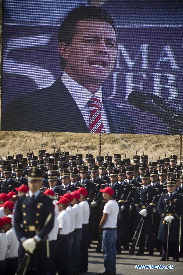Soldiers stand guard while Mexico's President Enrique Pena Nieto delivers a speech during the celebrations of 151st anniversary of the Battle of Puebla, in the city of Puebla, Mexico, on May 5, 2013. The Battle of Puebla took place on May 5, 1862 near the city of Puebla during the French intervention in Mexico. The Mexican victory is celebrated yearly on May 5. (Xinhua/Rodrigo oropeza)