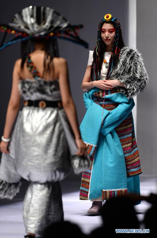 Models present traditional ethnic fashion creations during the 2013 China (Qingdao) International Fashion Week in Qingdao, a coastal city in east China's Shandong Province, May 5, 2013. (Xinhua/Li Ziheng) 