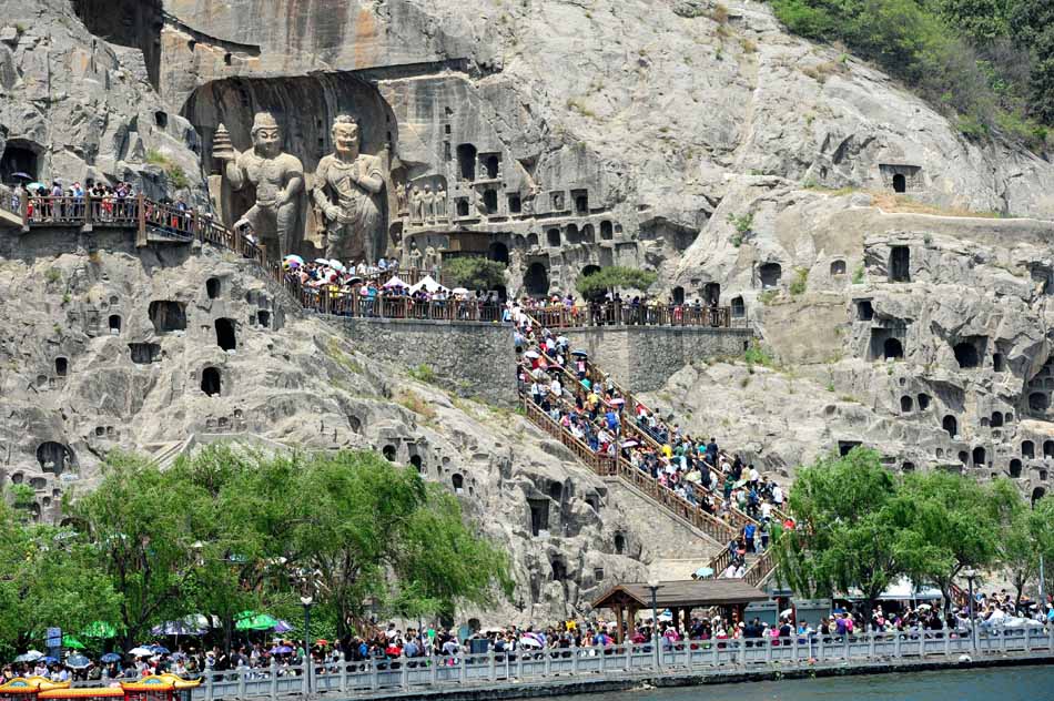The number of tourists to Longmen Grottoes breaks 30,000 on April 30 and continues to climb. Longmen Grottoes in central China's Henan province is a famous scenic spot which attracts many visitors from all over the world annually. (Xinhua Photo/ Zhang Yixi)