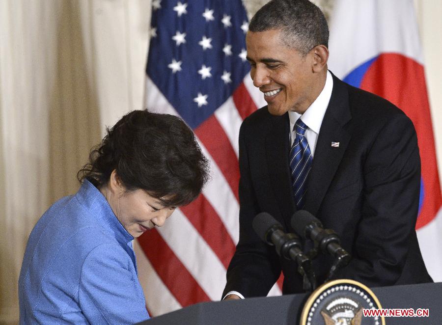 U.S. President Barack Obama (R) shakes hands with visiting South Korean President Park Geun-hye during a joint press conferece after their meetings in the East Room of the White House in Washington D.C., capital of the United States, May 7, 2013. (Xinhua/Zhang Jun) 