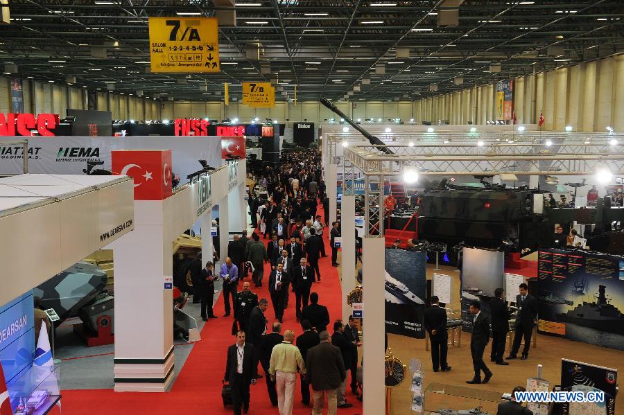 Visitors attend the 11th International Defence Industry Fair in Istanbul, Turkey, May 7, 2013. The 11th International Defence Industry Fair was opened on Tuesday, with 781 companies from 82 countries and regions attending the four-day fair. (Xinhua/Lu Zhe)