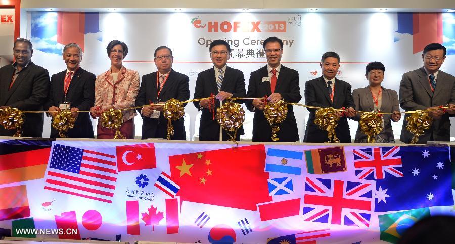 Honored guests cut ribbon at the opening ceremony of the 15th International Exhibition of Food & Drink, Hotel, Restaurant & Food Service Equipment, Supplies & Services (HOFEX) in south China's Hong Kong, May 7, 2013. The four-day HOFEX 2013 kicked off on Tuesday at Hong Kong Convention & Exhibition Center. (Xinhua/Chen Xiaowei)