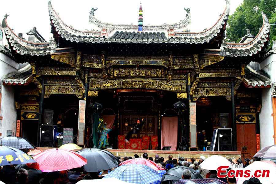 People enjoy Ganju Opera in front of the Mingfentang Stage in Huyan Village, Zhenqiao County, Leping City, Jiangxi Province. The Ganju Opera is a local opera popular in many areas of Jiangxi. The Mingfentang Stage, which was built in Qing Dynasty with the construction beginning in 1817, has been listed as a key cultural heritage site under state protection.  (CNS/Cheng Wanhai)