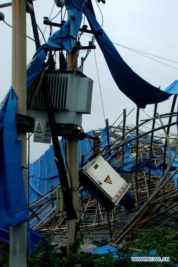 The sheds of a factory and electric power facilities are damaged by hails and storms at Maogoubao Village of Fuquan City, southwest China's Guizhou Province, May 7, 2013. The central, south central and southeast parts of Guizhou were hit by hails and storms from Monday to Tuesday, disturbing local traffic and power service and causing damage to agricultural production. (Xinhua/Wu Rubo)