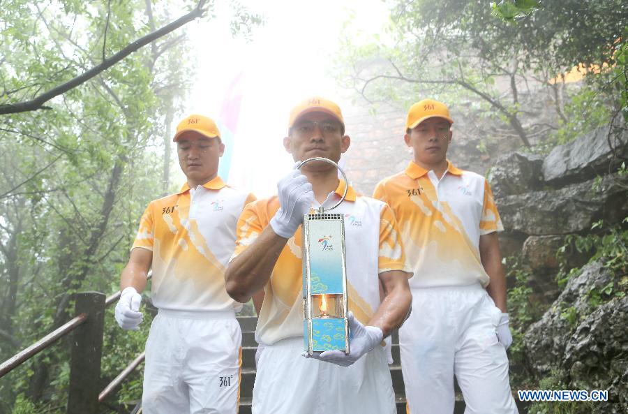 Flame guards transport the Flame in a lantern during the 2nd Asian Youth Games Flame-Lighting ceremony in Nanjing, capital of east China's Jiangsu Province on May 8, 2013. The 2nd Asian Youth Games will be held in Nanjing on August 16, 2013. (Xinhua/Yang Lei)