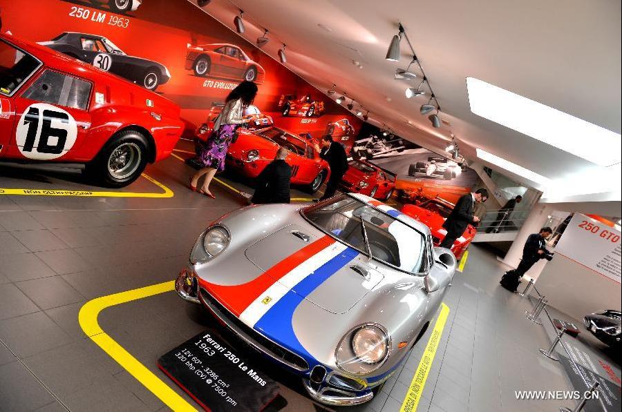 Visitors tour the Ferrari Museum in Maranello, north Italy, May 7, 2013. The Ferrari Museum in Maranello is the only official museum directly run by Ferrari, offering visitors an authentic Ferrari experience with virtual driving and the company's history. (Xinhua/Xu Nizhi) 