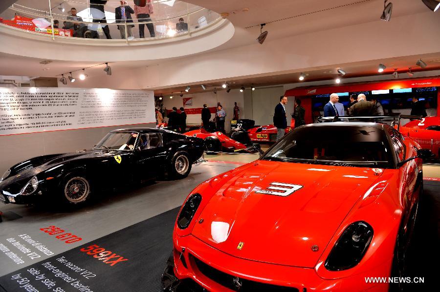 Visitors tour the Ferrari Museum in Maranello, north Italy, May 7, 2013. The Ferrari Museum in Maranello is the only official museum directly run by Ferrari, offering visitors an authentic Ferrari experience with virtual driving and the company's history. (Xinhua/Xu Nizhi) 