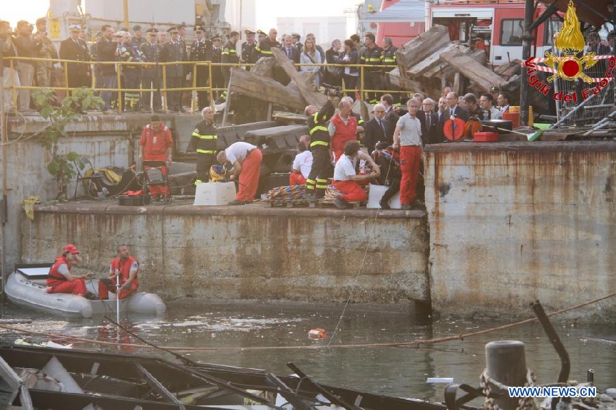 This photo released by Italian Vigili del Fuoco (Italian fire service) shows rescuers working at the ship accident site at north Italy's Genoa port on May 8, 2013. The death toll of the Italian ship's accident in the northern Genoa port rose to seven late on Wednesday while more were injured or missing. Divers were still searching bodies trapped in the underwater rubble of a 50-meter-tall control tower that was demolished by the container ship Jolly Nero on Tuesday night. The ship, 239 meters long and with a gross tonnage of nearly 40,600 tonnes, suddenly crashed into the concrete and glass tower while maneuvering out the port in calm conditions. (Xinhua/Italian Vigili del Fuoco)