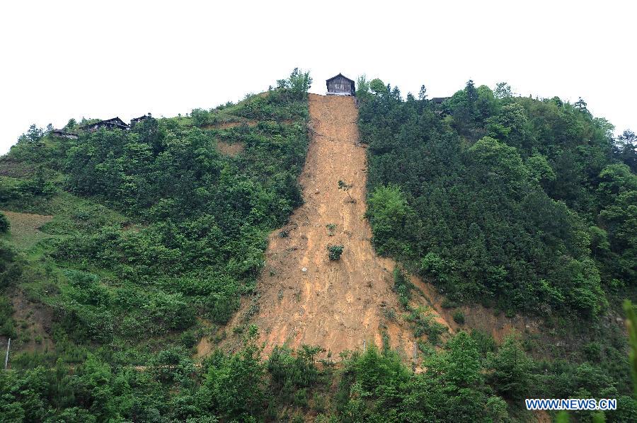 A landslide caused by storms is seen in Zaisu Village of Danzhai County, southwest China's Guizhou Province, May 8, 2013. Six counties in the Qiandongnan Miao-Dong Autonomous Prefecture in southeast Guizhou were hit by hails and storms from Tuesday to Wednesday. About 12,000 local residents have been affected. (Xinhua/Chen Peiliang)