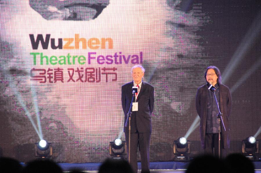Chinese director Stan Lai (R) and honorary chairman of the Wuzhen Theatre Festival Robert Brustein address the opening ceremony of the festival in Wuzhen, east China's Zhejiang Province, May 9, 2013. The festival which will last till May 19 kicked off on Thursday. (Xinhua/Cao Dian)