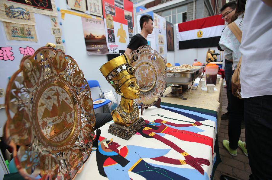 Egyptian craftworks are displayed during the opening of the fourth International Cultural Festival held by the University of International Business and Economics (UIBE) in Beijing, capital of China, May 9, 2013. The cultural festival offered a stage for students from different countries to present their own culture. (Xinhua/Wan Xiang) 