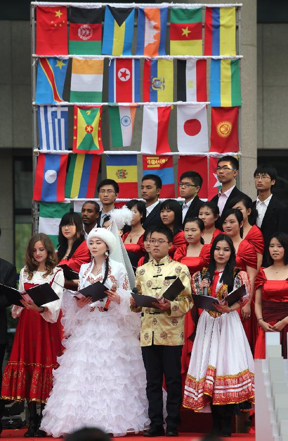 Student from different countries present a reading session during the opening of the fourth International Cultural Festival held by the University of International Business and Economics (UIBE) in Beijing, capital of China, May 9, 2013. The cultural festival offered a stage for students from different countries to present their own culture. (Xinhua/Wan Xiang) 