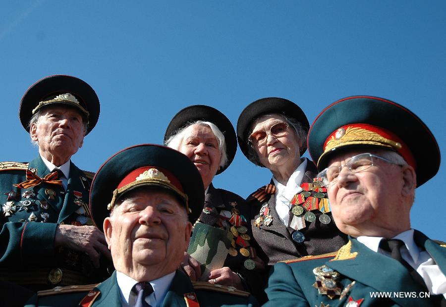 Veterans attend the Victory Day parade at the Red Square in Moscow, Russia, May 9, 2013. A grand parade was held on Thursday at the Red Square to mark the 68th anniversary of the Soviet Union's victory over Nazi Germany in the Great Patriotic War.(Xinhua/Ding Yuan)