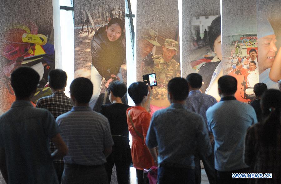 People visit the Wenchuan Earthquake Memorial Museum in the town of Qushan, Beichuan Qiang Autonomous County, southwest China's Sichuan Province, May 9, 2013. The museum was officially opened to the public for free on Thursday to commemorate the fifth anniversary of the Wenchuan earthquake, which hit Sichuan on May 12, 2008 and left more than 87,000 people dead or missing. (Xinhua/Xue Yubin) 