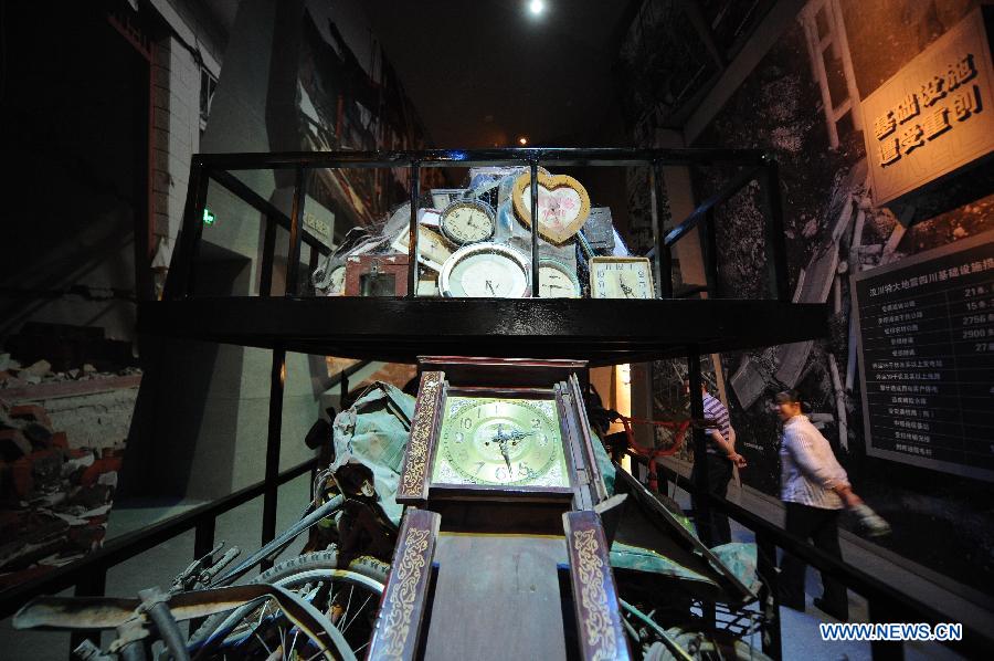 People visit the Wenchuan Earthquake Memorial Museum in the town of Qushan, Beichuan Qiang Autonomous County, southwest China's Sichuan Province, May 9, 2013. The museum was officially opened to the public for free on Thursday to commemorate the fifth anniversary of the Wenchuan earthquake, which hit Sichuan on May 12, 2008 and left more than 87,000 people dead or missing. (Xinhua/Xue Yubin)