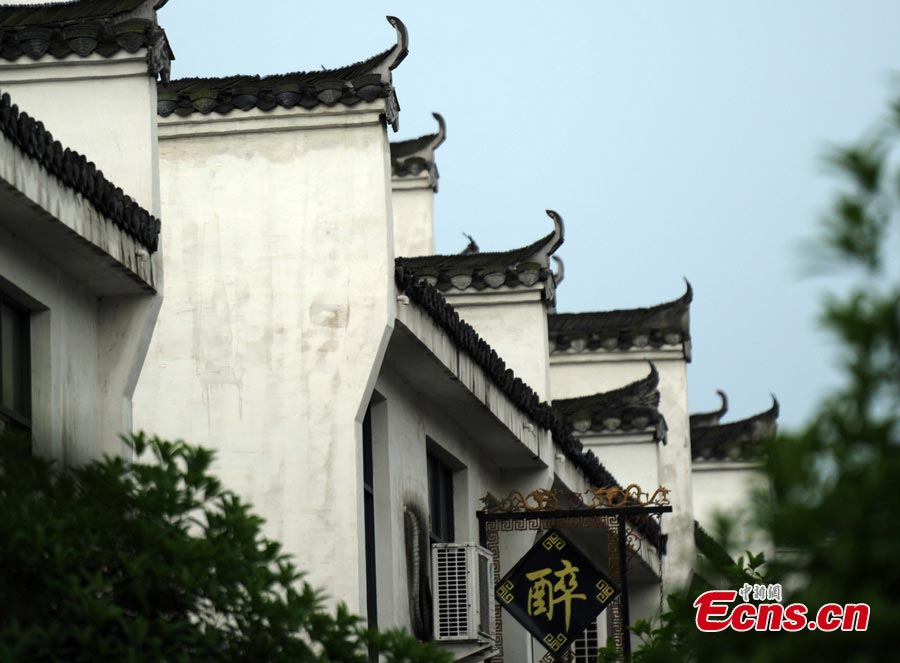 Photo shows grey-tiled and white-walled houses featuring Hui-style architecture in Baimaguan County, Luojiang, Sichuan Province. Many of those houses were damaged during the Wenchuan earthquake on May 12, 2008. But they have been restored five years later, which transformed the county into a tourist attraction. Baimaguan used to be a famous battlefield during the Three Kingdoms period (220 AD-280AD). (CNS/Liu Zhongjun)