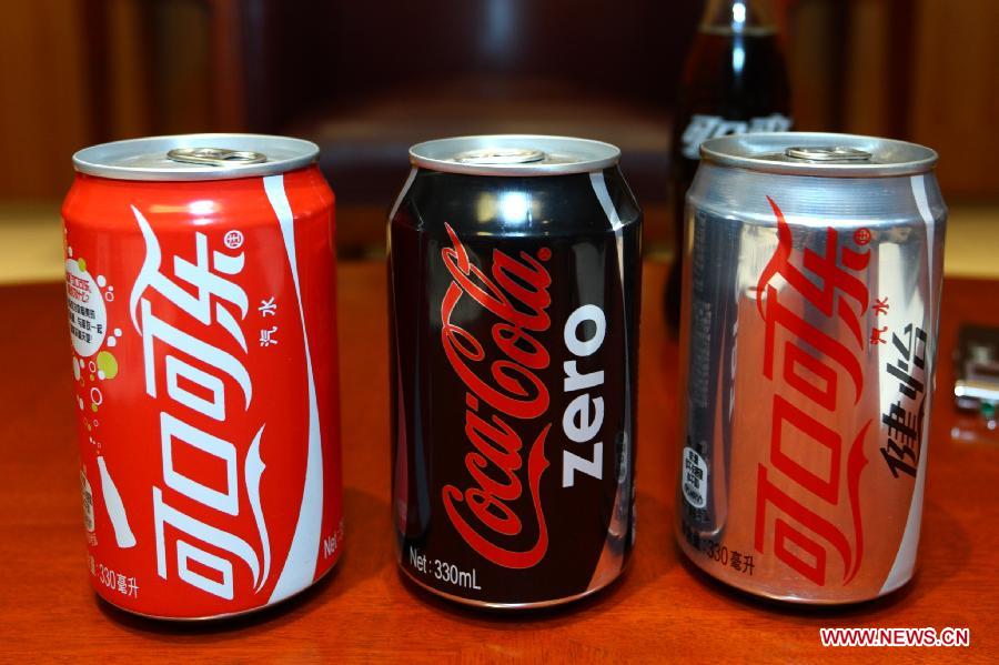 Photo taken on May 9, 2013 shows the canned drink of Coca-Cola in Beijing, capital of China. The Coca-Cola Company announced here on Thursday that it will continue to increase investment levels in China. Ahmet Bozer, president of Coca-Cola International, said during an interview that 4 billion U.S. dollars of investment will be added by 2014 in China. And he explained that the investment is mixed with marketing assets like plants, transportation and retail outlets. (Xinhua/Wu Kaixiang) 