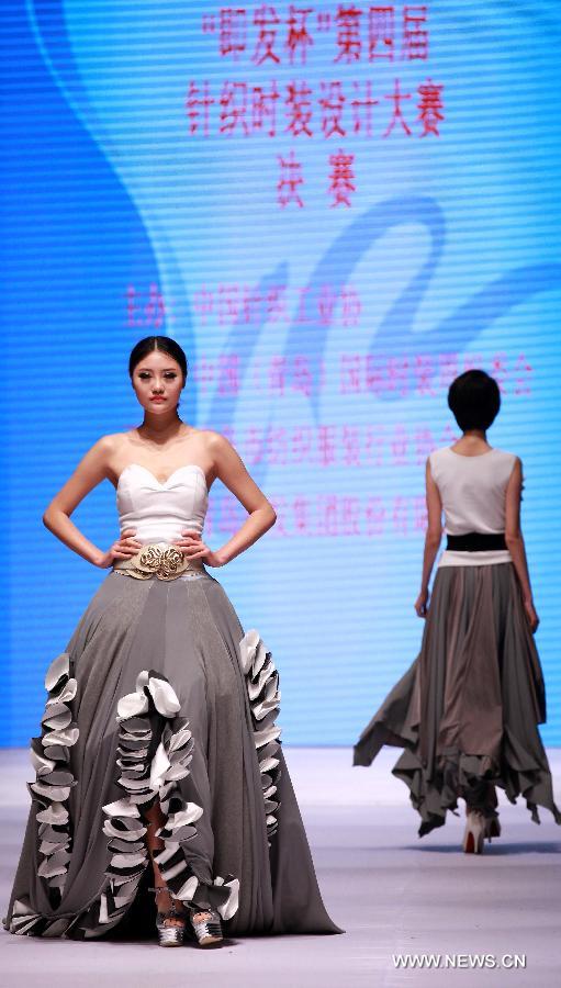 Models present fashion creations during the final of a knitting fashion design contest in Qingdao, a coastal city in east China's Shandong Province, May 7, 2013. (Xinhua/Liang Xiaopeng) 