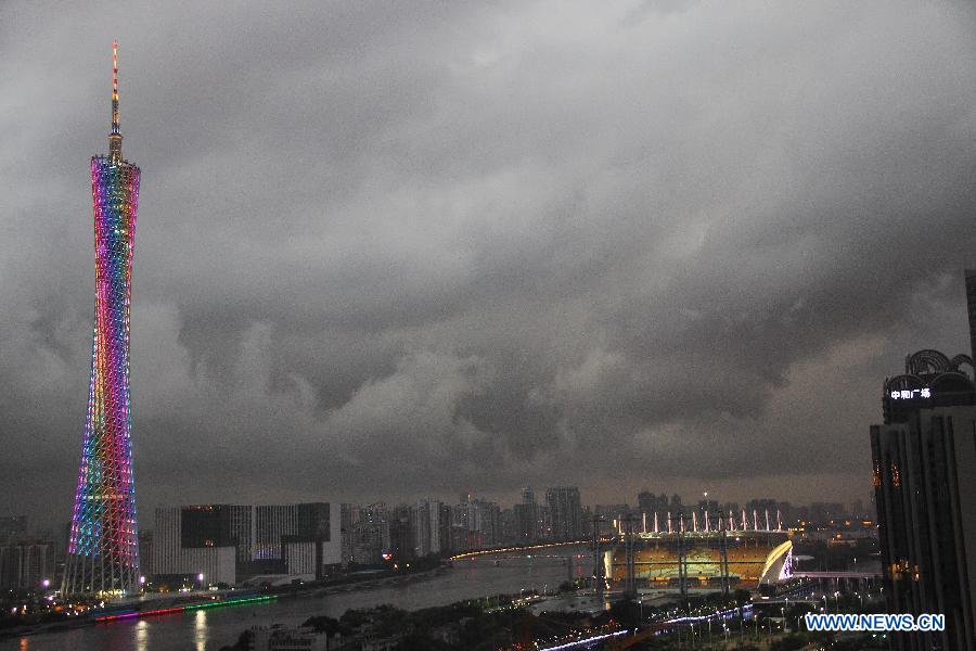 Black clouds cover the sky of Guangzhou as the Canton Tower shines brightly in Guangzhou, capital of south China's Guangdong Province, May 9, 2013. (Xinhua/Zheng Kaifu)