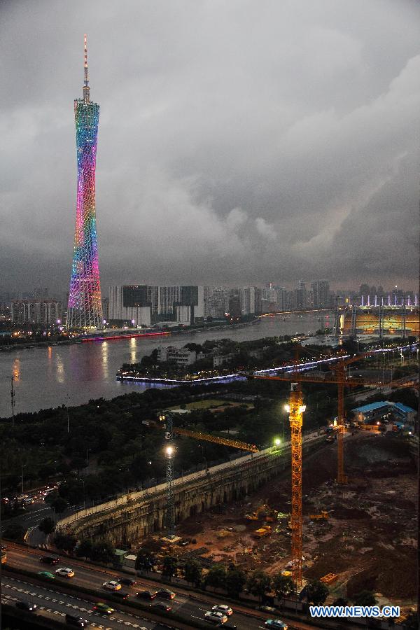 Black clouds cover the sky of Guangzhou as the Canton Tower shines brightly in Guangzhou, capital of south China's Guangdong Province, May 9, 2013. (Xinhua/Zheng Kaifu) 