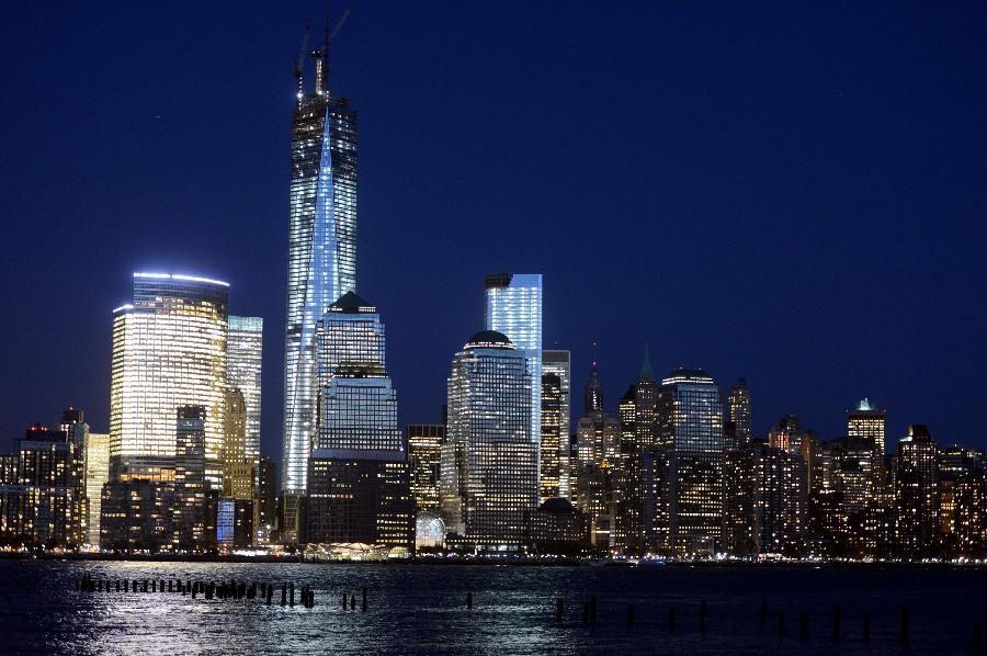 Filed photo taken on May 1, 2013 shows the night view of One World Trade Center (WTC) in New York. Workers have installed the final sections of the silver spire atop WTC on Friday, which brings the iconic New York City structure to its full, symbolic height of 1,776 feet (541 meters). (Xinhua/Wang Lei) 