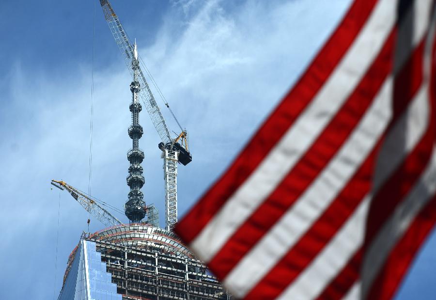 Photo taken on May 10, 2013 shows new silver spire atop One World Trade Center (WTC) in New York. Workers have installed the final sections of the silver spire atop WTC on Friday, which brings the iconic New York City structure to its full, symbolic height of 1,776 feet (541 meters). (Xinhua/Wang Lei) 