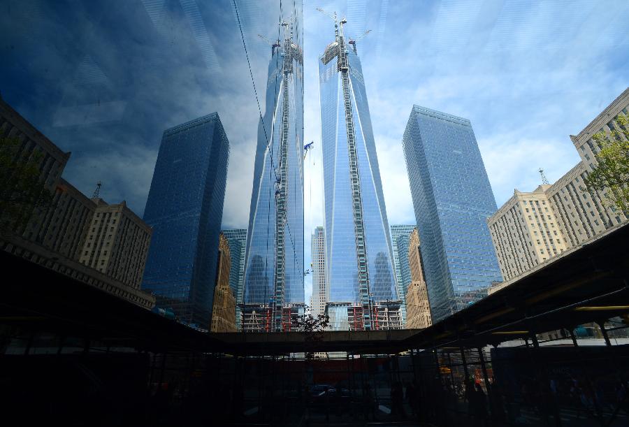 Photo taken on May 10, 2013 shows One World Trade Center (WTC) with new silver spire, in New York. Workers have installed the final sections of the silver spire atop WTC on Friday, which brings the iconic New York City structure to its full, symbolic height of 1,776 feet (541 meters). (Xinhua/Wang Lei) 