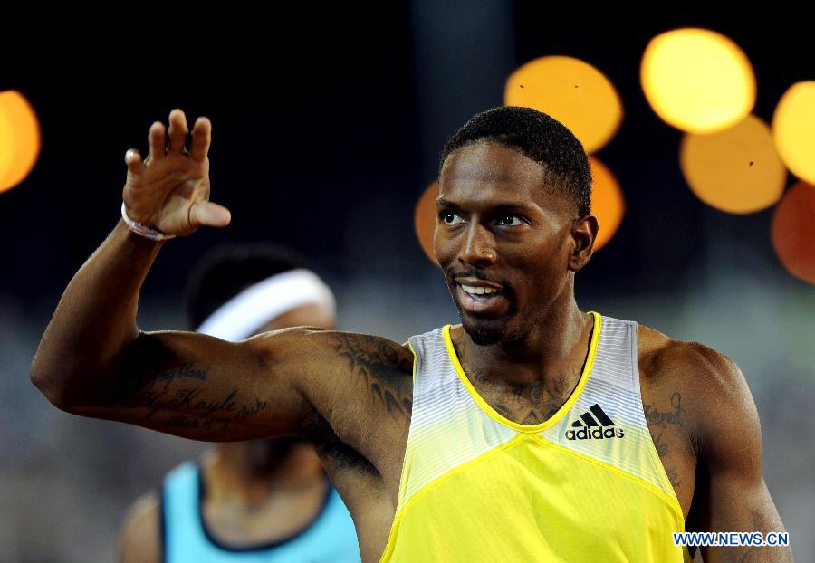 Michael Tinsley of the United States celebrates after the men's 400m hurdles final at the IAAF Diamond League in Doha, capital of Qatar, May 10, 2013. Tinsley claimed the title of the event with 48.92 seconds. (Xinhua/Chen Shaojin)