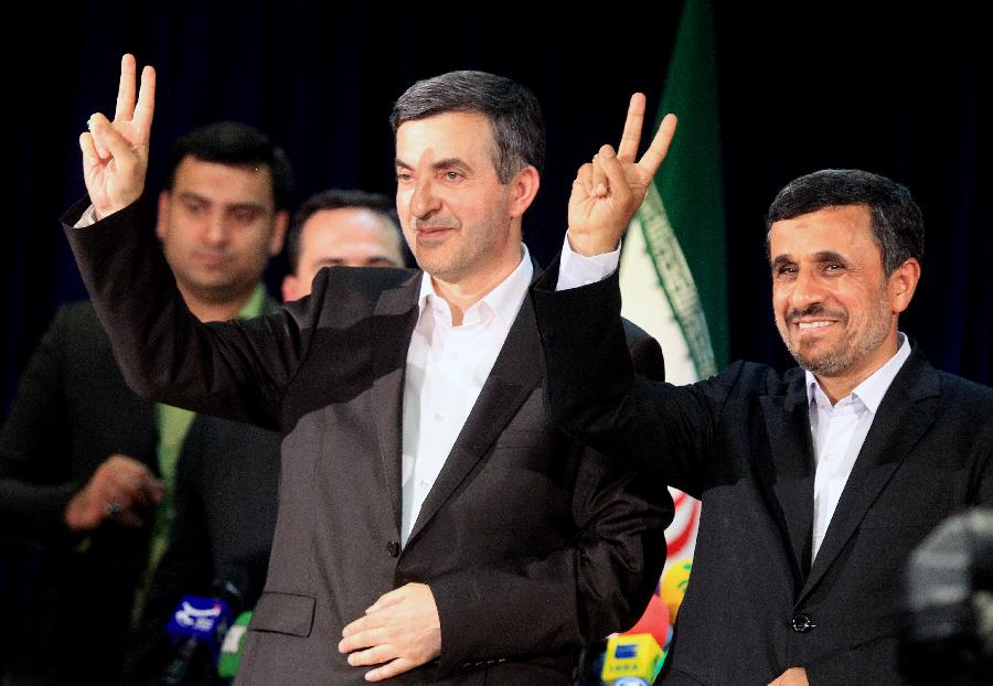 Iranian President Mahmoud Ahmadinejad (R) and his top aide Esfandiar Rahim-Mashaei gesture with "V" signs during a press conference after Rahim-Mashaei registered for Iran's 11th presidential election at the Interior Ministry in Tehran on May 11, 2013. (Xinhua/Ahmad Halabisaz) 