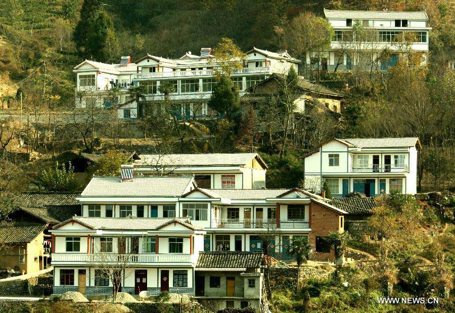 Photo taken on Nov. 20, 2010 shows newly-built houses in Songgou Village of Kangxian County in Longnan City, northwest China's Gansu Province. In the year of 2008, a massive earthquake occurred in Gansu's neighbouring province Sichuan, and Longnan was also battered by the disaster. During the past five years, a total of 3,905 reconstruction projects have been carried out in the city, where over 240,000 households have their houses rebuilt, and hundreds of schools and hospitals have been set up as well. (Xinhua/Wang Yaodong)