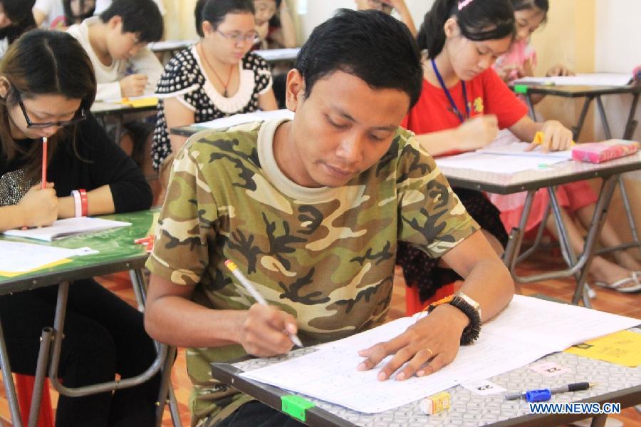 Candidates take an examination of HSK in Mandalay, Myanmar, on May 12, 2013. Hanyu Shuiping Kaoshi, known as HSK or a proficiency test on Chinese language for non-native speakers, held its first half of 2013 test in Northern Myanmar where 1281 candidates entered for the test. (Xinhua/Hou Baoqiang) 