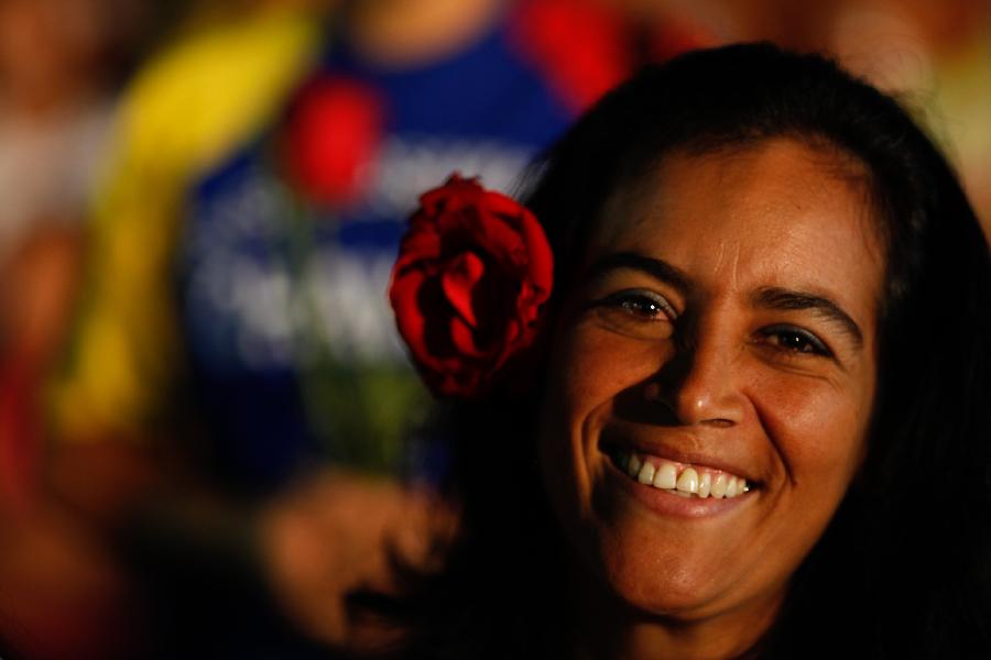 Image provided by Venezuela's Presidency shows a woman participating in a celebration of the Mother's Day in Caracas, capital of Venezuela, on May 11, 2013. (Xinhua/Venezuela's Presidency)